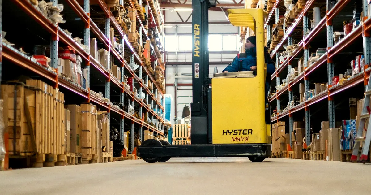 Electric forklift working inside a warehouse